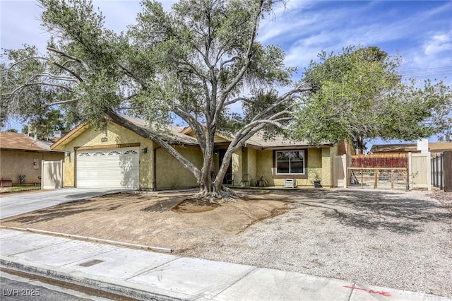 1012 Winwood St, Las Vegas, NV 89108 - view of front of house featuring driveway, stucco siding, a garage, and a gate