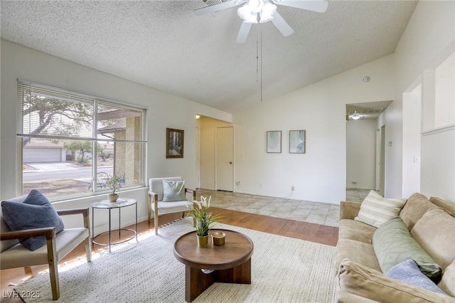 1012 Winwood St, Las Vegas, NV 89108 - living area featuring wood finished floors, vaulted ceiling, a ceiling fan, and a textured ceiling