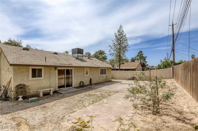 1012 Winwood St, Las Vegas, NV 89108 - rear view of property with a fenced backyard, stucco siding, a shingled roof, and a patio area