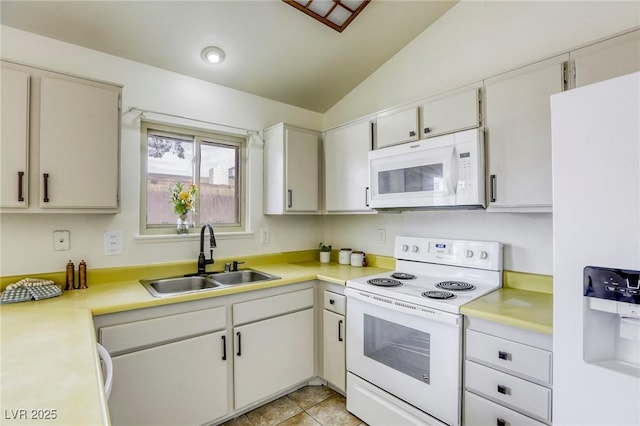 1012 Winwood St, Las Vegas, NV 89108 - kitchen featuring white appliances, a sink, lofted ceiling, light countertops, and light tile patterned flooring