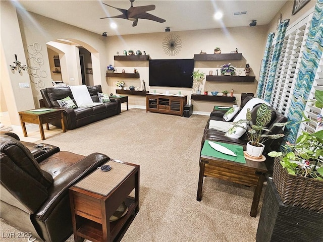 4242 Helena Hideaway Ct, Las Vegas, NV 89129 - living area featuring ceiling fan, carpet flooring, and arched walkways