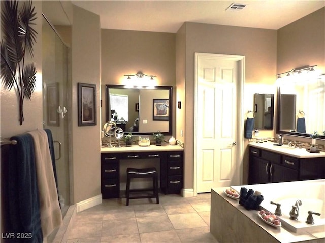 4242 Helena Hideaway Ct, Las Vegas, NV 89129 - full bathroom featuring a stall shower, vanity, tile patterned flooring, a garden tub, and baseboards