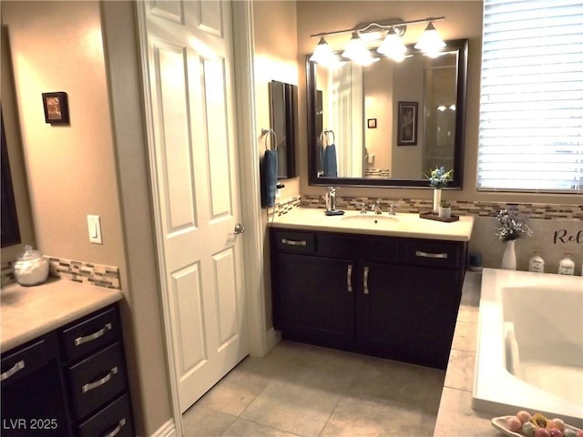 4242 Helena Hideaway Ct, Las Vegas, NV 89129 - full bathroom featuring tile patterned flooring, a tub, vanity, and backsplash