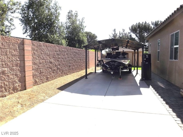 4242 Helena Hideaway Ct, Las Vegas, NV 89129 - fenced backyard with a carport and concrete driveway
