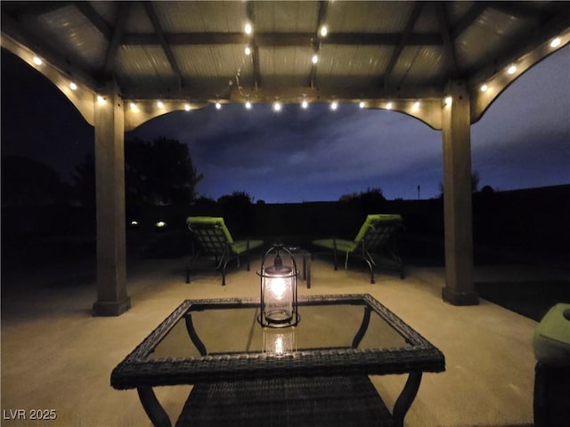 4242 Helena Hideaway Ct, Las Vegas, NV 89129 - patio at night with a gazebo and a patio area