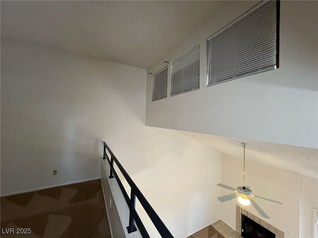 8940 Antioch Way, Las Vegas, NV 89117 - staircase with ceiling fan, a fireplace, carpet floors, and baseboards