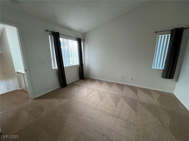 8940 Antioch Way, Las Vegas, NV 89117 - unfurnished bedroom with light colored carpet, a textured ceiling, and baseboards