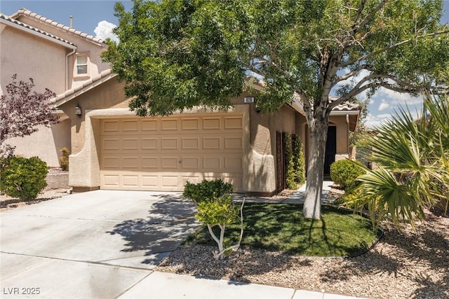 820 Bernini St, Las Vegas, NV 89144 - view of front of property featuring driveway, a garage, stucco siding, and a tiled roof