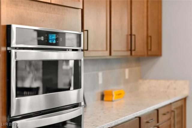 12430 Foxtail Run Ave, Las Vegas, NV 89138 - kitchen featuring double oven and decorative backsplash