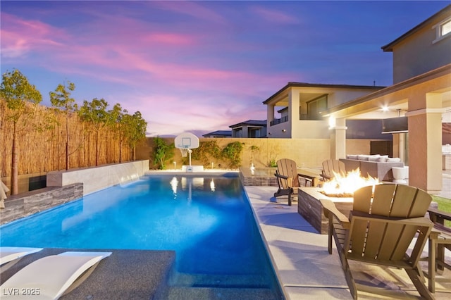 12430 Foxtail Run Ave, Las Vegas, NV 89138 - view of swimming pool with an outdoor fire pit and a patio area