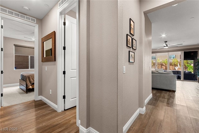12430 Foxtail Run Ave, Las Vegas, NV 89138 - hallway with hardwood / wood-style flooring and baseboards