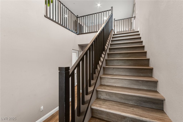12430 Foxtail Run Ave, Las Vegas, NV 89138 - stairway featuring a high ceiling and baseboards