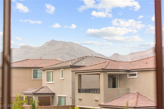 12430 Foxtail Run Ave, Las Vegas, NV 89138 - back of house featuring a mountain view, stucco siding, and a tile roof