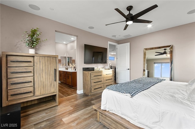 12430 Foxtail Run Ave, Las Vegas, NV 89138 - bedroom featuring wood finished floors, connected bathroom, and ceiling fan