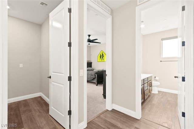 12430 Foxtail Run Ave, Las Vegas, NV 89138 - corridor with wood finished floors and baseboards