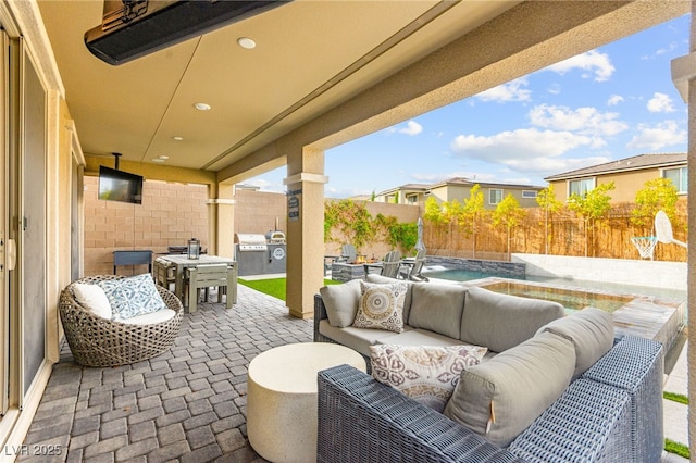 12430 Foxtail Run Ave, Las Vegas, NV 89138 - fenced backyard featuring an outdoor living space, a patio, and area for grilling