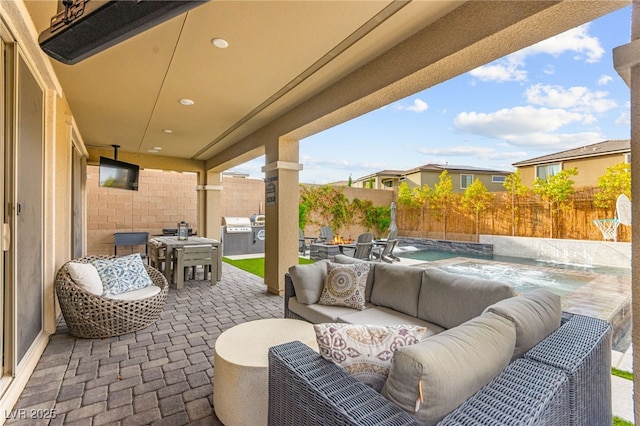 12430 Foxtail Run Ave, Las Vegas, NV 89138 - fenced backyard with outdoor lounge area, a patio, outdoor dining area, and a hot tub