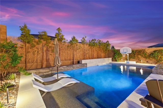 12430 Foxtail Run Ave, Las Vegas, NV 89138 - pool at dusk featuring a fenced backyard