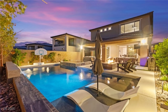 12430 Foxtail Run Ave, Las Vegas, NV 89138 - view of swimming pool with an outdoor fire pit, a fenced backyard, a patio, and a pool with connected hot tub
