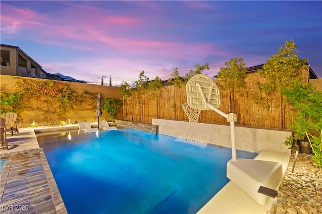 12430 Foxtail Run Ave, Las Vegas, NV 89138 - pool at dusk with a fenced backyard