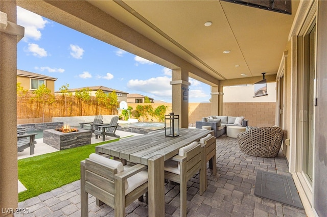 12430 Foxtail Run Ave, Las Vegas, NV 89138 - fenced backyard with a patio, an outdoor living space with a fire pit, and outdoor dining area