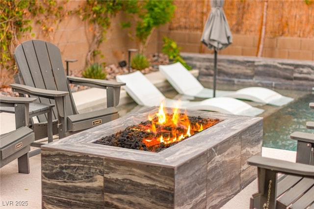 12430 Foxtail Run Ave, Las Vegas, NV 89138 - view of patio with an outdoor fire pit