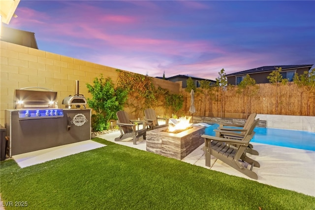 12430 Foxtail Run Ave, Las Vegas, NV 89138 - view of yard with an outdoor fire pit and a patio