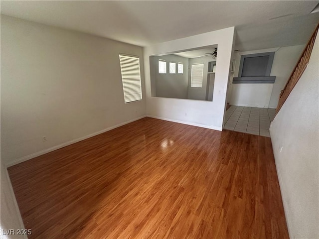 8215 Shell Beach Ct, Las Vegas, NV 89117 - unfurnished room with ceiling fan, light wood finished floors, and baseboards