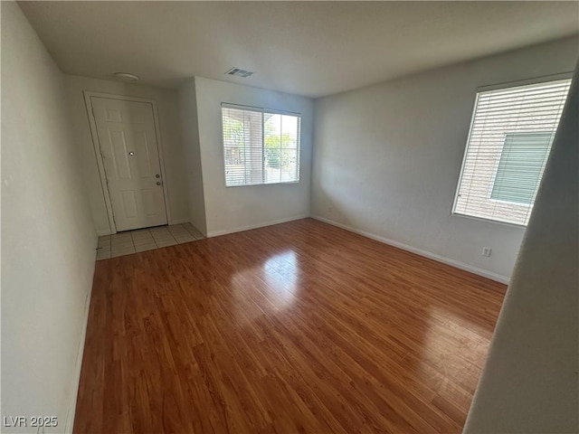 8215 Shell Beach Ct, Las Vegas, NV 89117 - spare room with wood finished floors and baseboards
