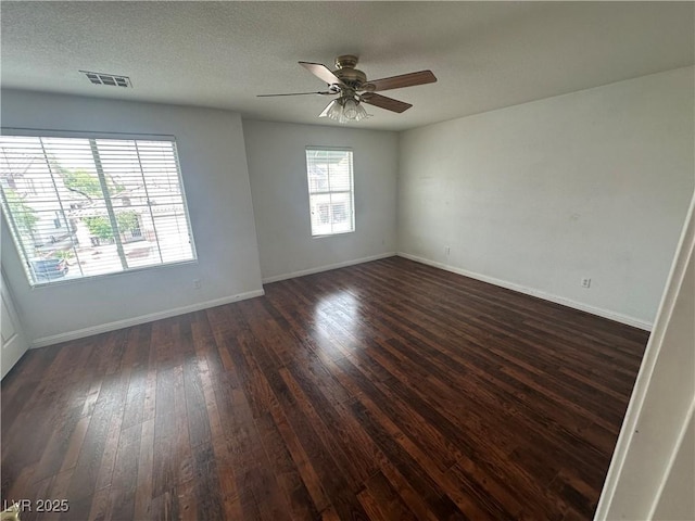 8215 Shell Beach Ct, Las Vegas, NV 89117 - unfurnished room with dark wood-type flooring, a ceiling fan, and baseboards