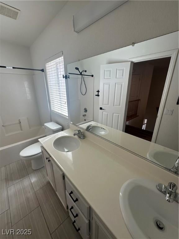 8215 Shell Beach Ct, Las Vegas, NV 89117 - bathroom featuring shower / bath combination, toilet, and double vanity