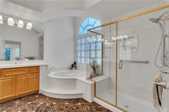 4196 Balmoral Castle Ct, Las Vegas, NV 89141 - full bathroom featuring vanity, a shower stall, a garden tub, and healthy amount of natural light
