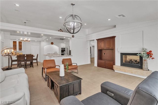 4196 Balmoral Castle Ct, Las Vegas, NV 89141 - living area featuring a chandelier, a fireplace, light tile patterned floors, and recessed lighting
