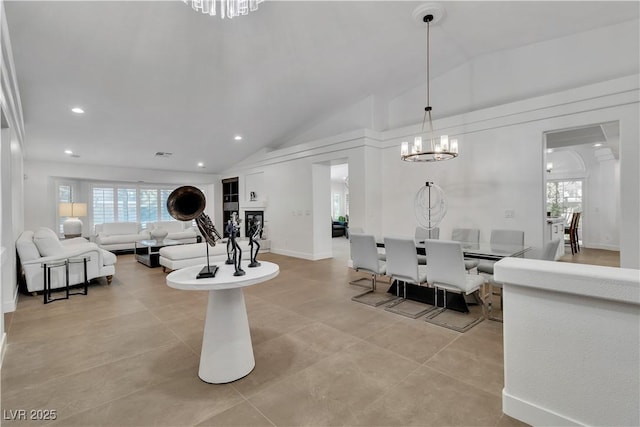 4196 Balmoral Castle Ct, Las Vegas, NV 89141 - living room featuring a chandelier, vaulted ceiling, and recessed lighting