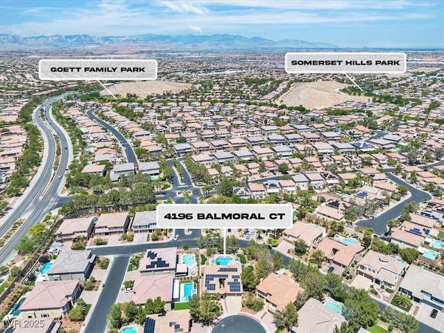 4196 Balmoral Castle Ct, Las Vegas, NV 89141 - aerial overview of property's location with a mountain backdrop and nearby suburban area