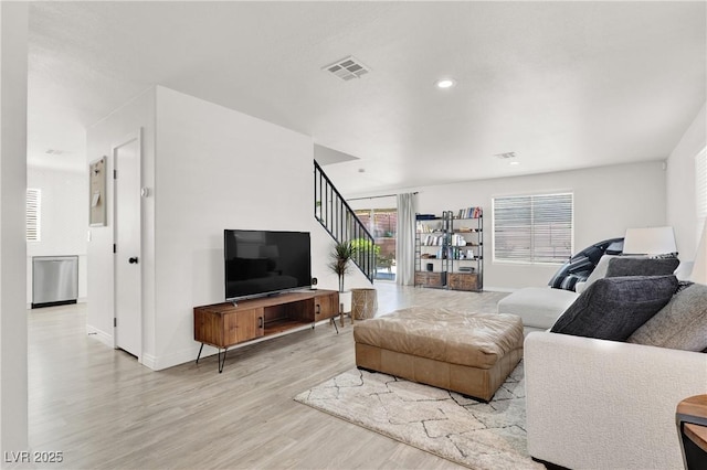 10554 Lilac Tree Ave, Las Vegas, NV 89135 - living area featuring light wood-style flooring, stairway, baseboards, and recessed lighting