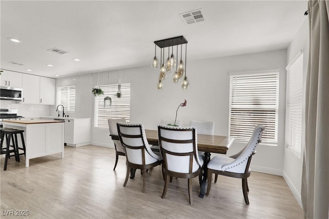 10554 Lilac Tree Ave, Las Vegas, NV 89135 - dining room with light wood-style flooring, baseboards, and recessed lighting