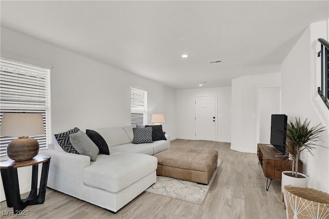 10554 Lilac Tree Ave, Las Vegas, NV 89135 - living room with light wood finished floors, recessed lighting, and baseboards