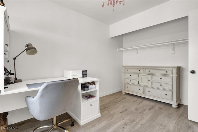 10554 Lilac Tree Ave, Las Vegas, NV 89135 - office area with light wood-style flooring and baseboards