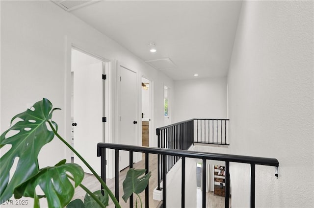 10554 Lilac Tree Ave, Las Vegas, NV 89135 - hallway featuring an upstairs landing, attic access, wood finished floors, and recessed lighting