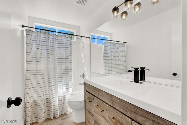 10554 Lilac Tree Ave, Las Vegas, NV 89135 - bathroom featuring toilet, vanity, shower / tub combo with curtain, and wood finished floors