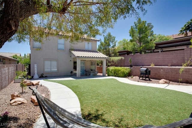 10554 Lilac Tree Ave, Las Vegas, NV 89135 - rear view of house featuring stucco siding, a patio area, and a tile roof