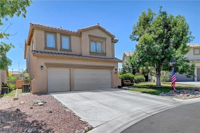 8333 Valley Stream Ave, Las Vegas, NV 89131 - mediterranean / spanish house with an attached garage, a tiled roof, and stucco siding