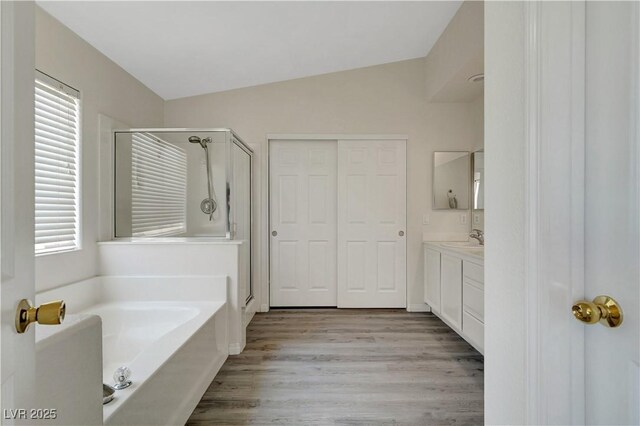 8333 Valley Stream Ave, Las Vegas, NV 89131 - full bath with a shower stall, plenty of natural light, a bath, and lofted ceiling