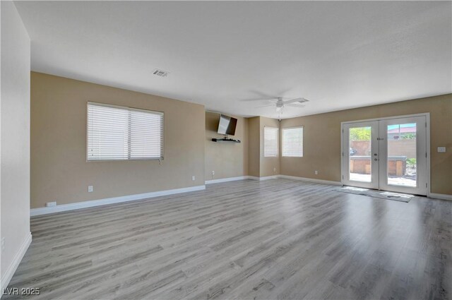 8333 Valley Stream Ave, Las Vegas, NV 89131 - spare room featuring light wood finished floors, french doors, ceiling fan, and baseboards
