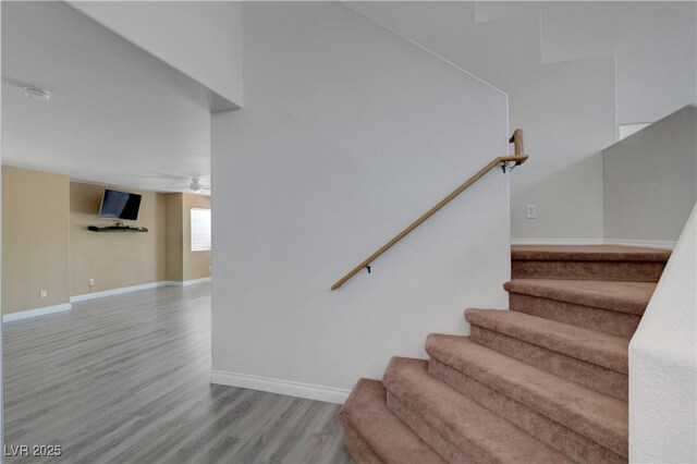 8333 Valley Stream Ave, Las Vegas, NV 89131 - staircase featuring wood finished floors, baseboards, and a ceiling fan