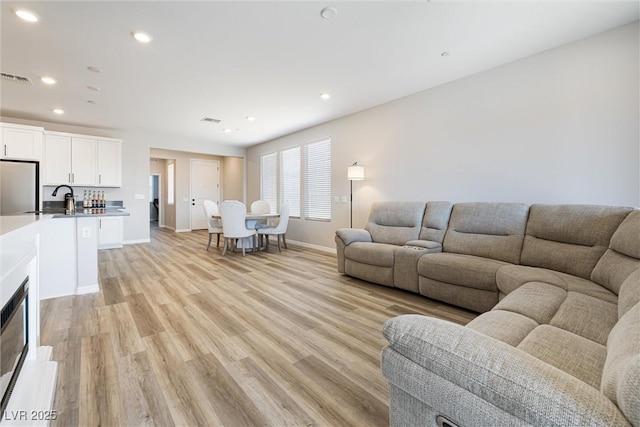 171 Palm Fox Ct, Henderson, NV 89011 - living area with baseboards, light wood finished floors, and recessed lighting