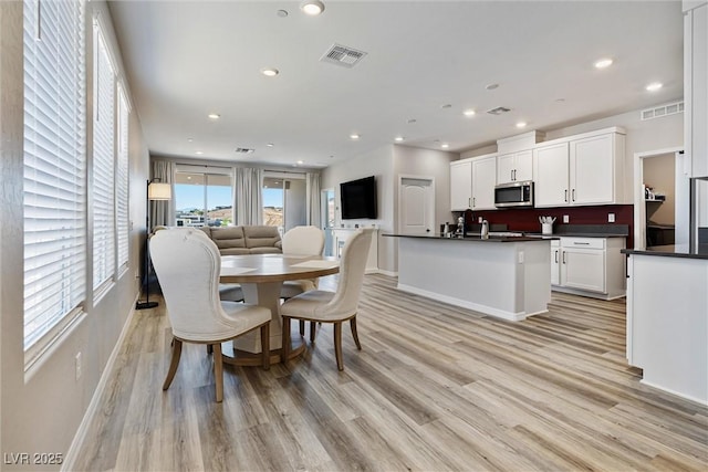 171 Palm Fox Ct, Henderson, NV 89011 - dining area with light wood-type flooring, recessed lighting, and baseboards