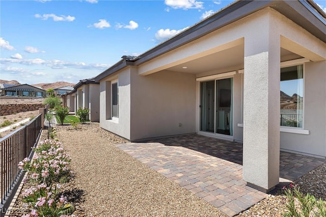 171 Palm Fox Ct, Henderson, NV 89011 - view of side of property with stucco siding and a patio