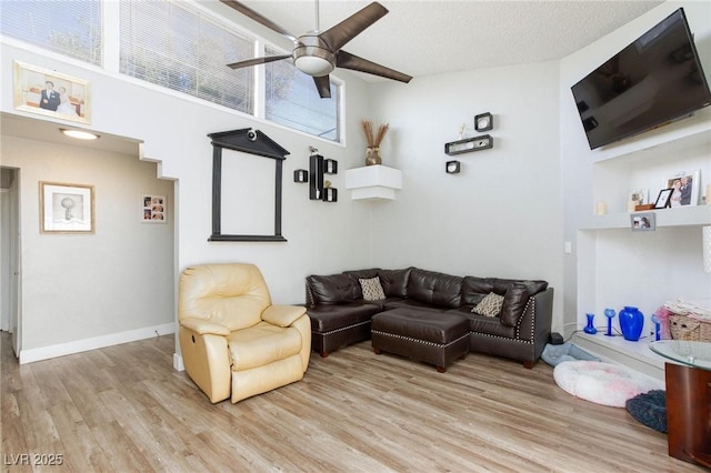 45 N Lamb Blvd, Las Vegas, NV 89110 - living area with light wood-style flooring, a ceiling fan, and baseboards